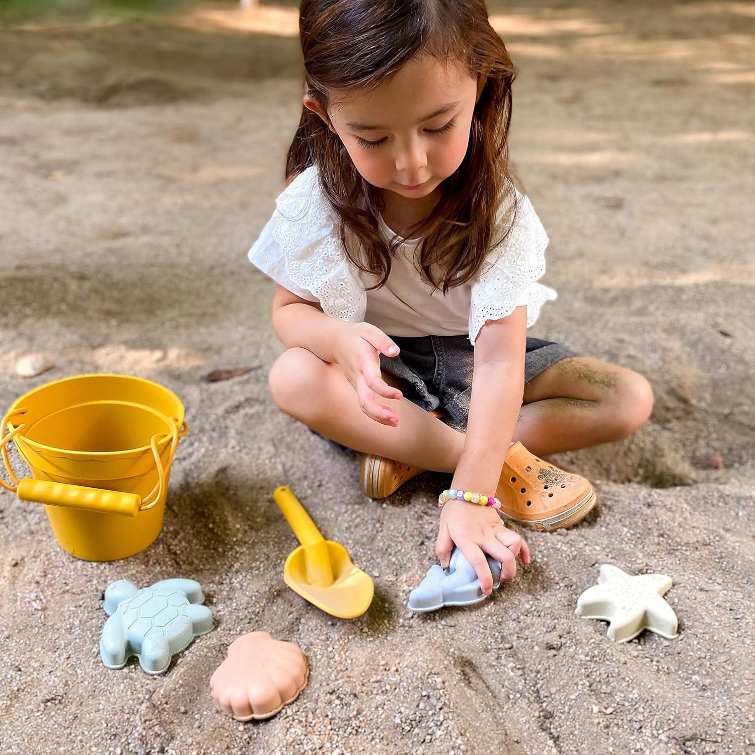 imageBLUE GINKGO Silicone Beach Toys Modern Baby Travel Friendly Toys Set Silicone Bucket Shovel 4 Sand Molds Beach Bag Sand Toys for Toddlers Kids YellowGreen